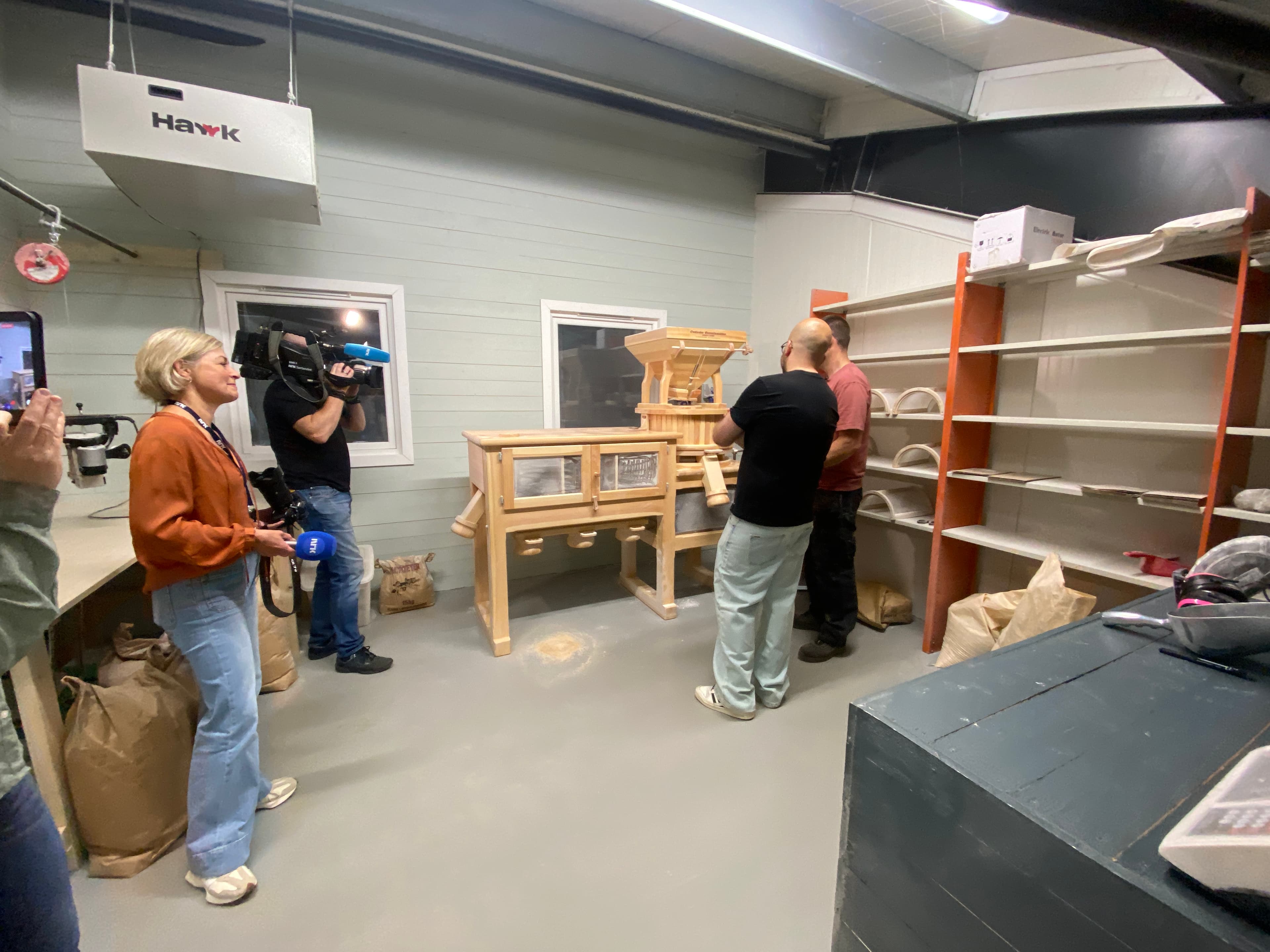 NRK filming in the mill at Øvre Åbål Gård